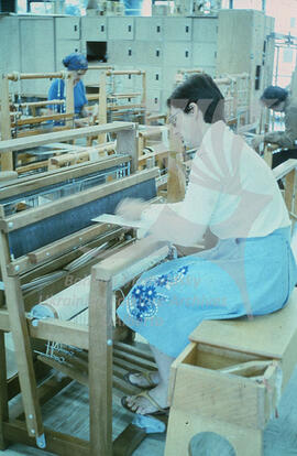 At the weaving loom