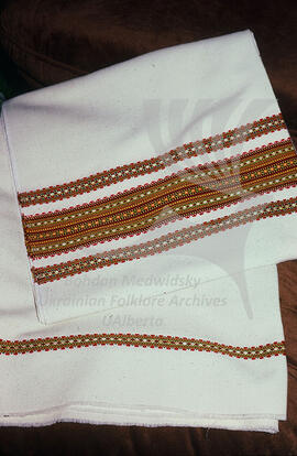 Woven fabric with embroidery on it