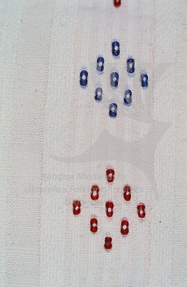 Embroidery with beads.