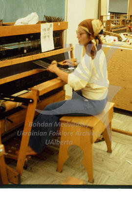 At the weaving loom