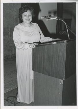 Photo of Mary Lobay at podium