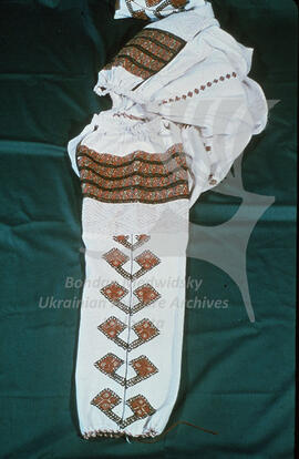 Embroidered sleeve of a woman's blouse.