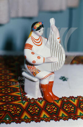 Ceramic statuette of a Ukrainian girl playing bandura
